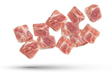 Raw pork cubes. Cubes of pieces of pork scatter in different directions, isolated on a white...