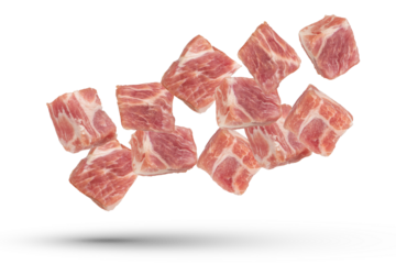 Raw pork cubes. Cubes of pieces of pork scatter in different directions, isolated on a white background. Isolate cubes of juicy pork for inserting into a design or project.