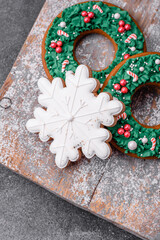 Delicious beautiful Christmas gingerbread cookies on a textured concrete background