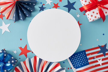 Obraz premium America's Birthday concept. Top view flat lay of american flag, patriotic folding paper fans, hearts, star-shaped confetti on light blue background with blank circle for ads or greetings