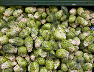 Brussel sprouts in bags at market. 