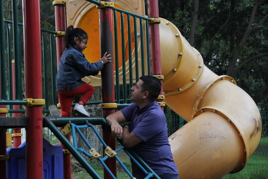 Divorced Single Dad And 4-year-old Daughter Latino Brunettes Play On Outdoor Park Playground Spend Quality Time Together Tech-free