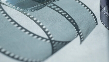 background with film strip.abstract background with shadows from film strip on gray surface for banner background