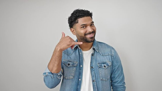 African american man smiling confident doing telephone gesture with hand over isolated white background