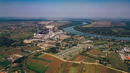 Areal drone footage of a power plant in a small town