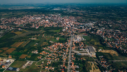 Areal drone footage of a suburb small town with private houses