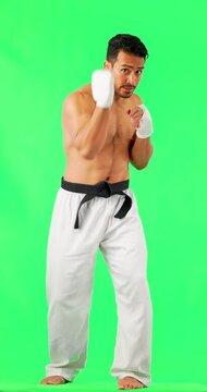 Martial arts, boxing and man portrait with green screen and fitness ready for fight. Boxer, karate and mma punch of Asian male athlete with exercise, motivation and training for kickboxing in studio
