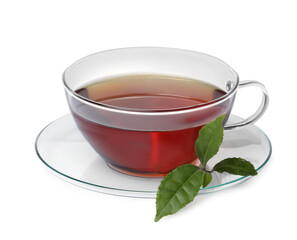 Glass cup of hot aromatic tea and green leaves on white background