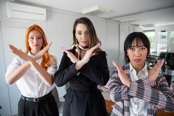 Three businesswomen hand gesturing Break the bias in the office. Feminist movement