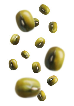 Raw mung beans falling on white background