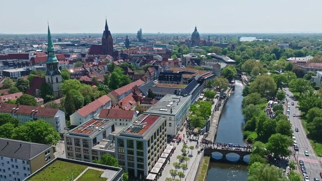 Drone shot of Hanover city centre , Germany . The historic heart of the city, Mitte is full of restaurants, cafes, and department stores. Monuments dot the largely pedestrianized Altstadt area .