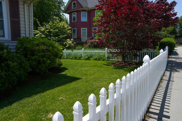 white fence and American home house 
