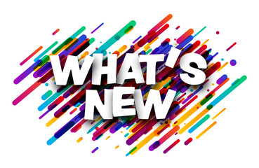 What's new sign over colorful brush strokes confetti background.
