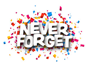 Never forget sign over colorful cut out ribbon confetti background.