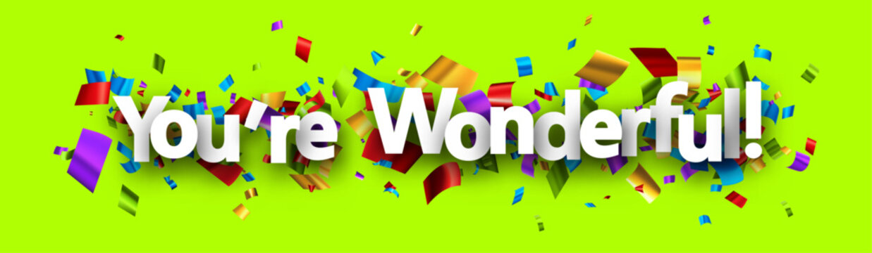 You are wonderful sign over colorful cut out ribbon confetti background.