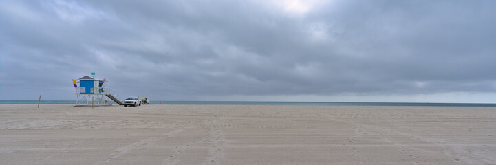 Deserted sand beach at Mimai during cloudy winter day 