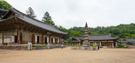 Pagoda (center) and Daegwangbojeon Hall (left) at historical Magoksa Temple or monastery in Gongju, South Korea. UNESCO World Heritage Site. Tourist attraction.