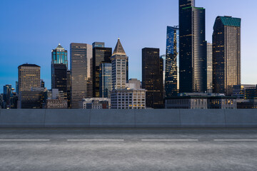 Empty urban asphalt road exterior with city buildings background. New modern highway concrete construction. Concept way to success. Transportation logistic industry fast delivery. Seattle. USA.