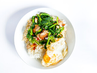 Crispy pork with Chinese broccoli on rice and fried egg