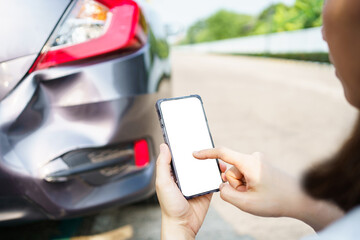 Asian woman got a car accident or car crash and using smartphone to call for road side emergency service. Woman texting on smartphone to call insurance assistant service.