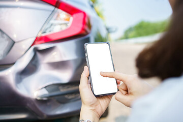 Asian woman got a car accident or car crash and using smartphone to call for road side emergency...