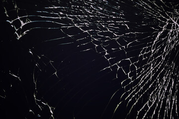 Cracked glass texture on black background. Isolated realistic cracked glass effect.