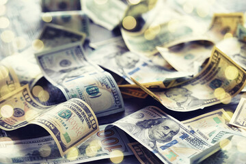 Money scattered on the desk. Money, US dollar bills background. Photography for Finance and Economy...
