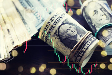 United States dollars. Pile of hundred USD banknotes. Green toned photo with selective focus