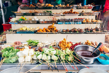 different kind of food is displayed at market stall