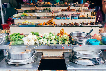 different kind of food is displayed at market stall