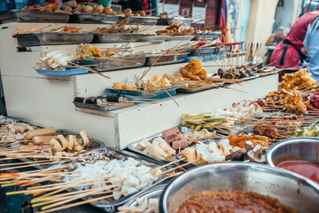 different kind of food is displayed at market stall