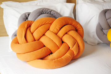 colorful pillow on white bed 