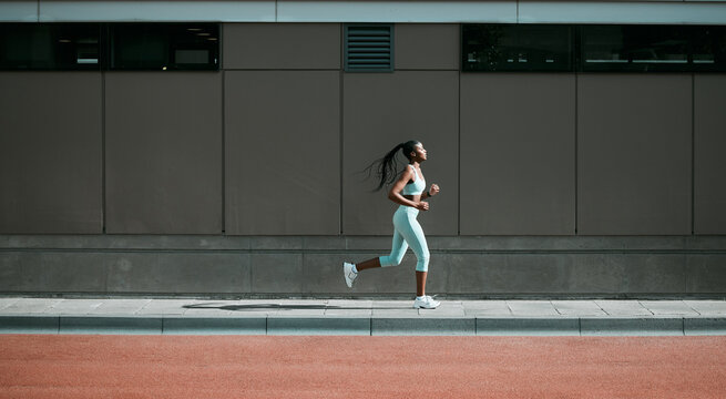 Black woman, running and city sport on sidewalk with training, exercise and fitness on road. Street, urban runner and female athlete with mockup and body workout for health, wellness and race outdoor