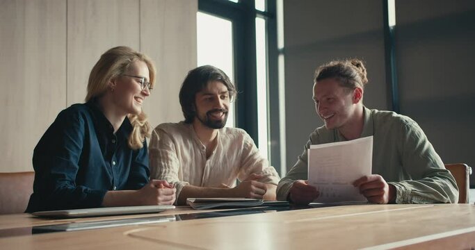 Sunlit Office Connections: Dynamic Conversations and Joyful Laughter with the Blonde Girl and Two Guys