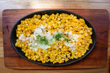 Jasuke is indonesian snacks made from steamed sweet corn mixed with milk and melted cheese.