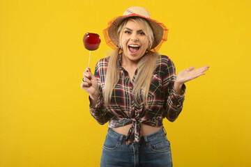 Beautiful brazilian woman, with festa junina clothes, on yellow background