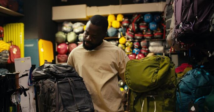 Decoding Adventure: An Afroamerican's Dual Backpack Dilemma in a Specialized Gear Store