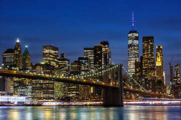 New York City skyline of Manhattan with Brooklyn Bridge and World Trade Center skyscraper at...