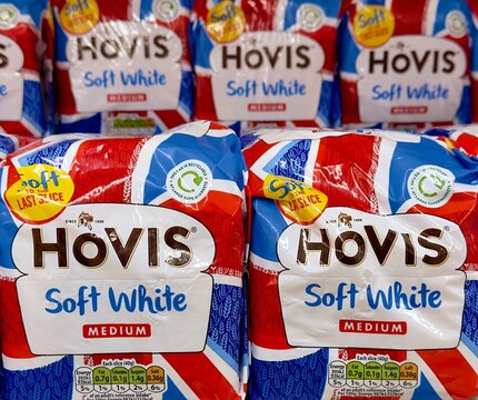 Essex, UK - June 1, 2023: Closeup of Hovis soft white bread in plastic bags on sale in a supermarket. 