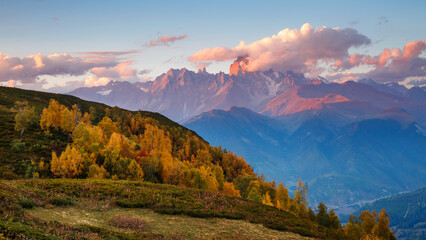 A fantastic sunset with colorful clouds overlooking Mount Ushba. Georgia, High Caucasus ridge.