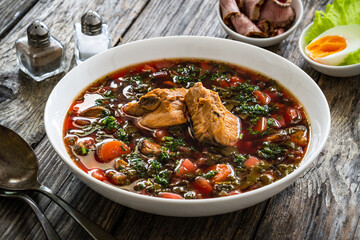 Borsch - beetroots soup on wooden table
