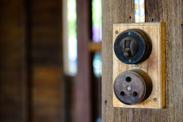 old electrical switch Installed on a wooden pole