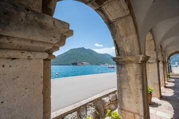 Perast churches through the arches