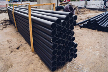 Big construction site with pipes and wires in the construction area.