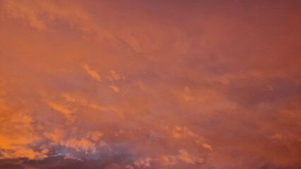 Fototapeta premium View of clouds in a orange red sunset 