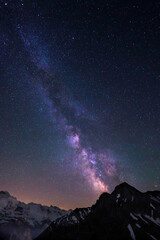 Milky Way and stars in night sky over the Swiss Alps at Lauterbrunnen with Jungfrau peaks