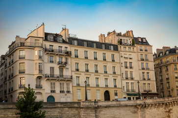 Fototapeta na wymiar Exterior view of an aged gray residential building located in Paris.