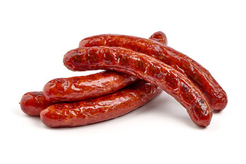 German grilled pork sausages with tomato sauce, close-up, isolated on white background.