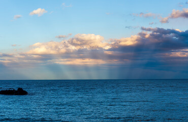 amazing evening or morning sea shore landscape of blue water, rock coast and unique natural...