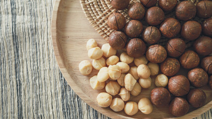 Organic Macadamia nut. macadamia nuts are cracked and baked to taste extremely delicious superfood fresh natural shelled unsalted raw macadamia and healthy food concept